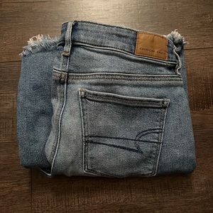 AE Low-Rise Ripped Flare Jeans